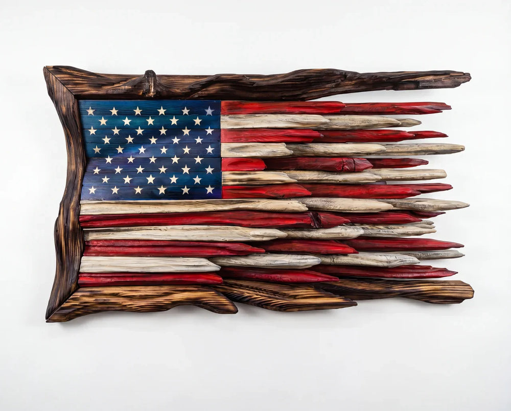 The Old Glory Battle Flag: carved wooden American flag with torched frame, on white background